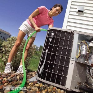 woman cleaning Air Conditioner